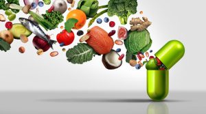 Nutritional supplement and vitamin supplements as a capsule with fruit vegetables nuts and beans inside a nutrient pill as a natural medicine health treatment with 3D illustration elements.